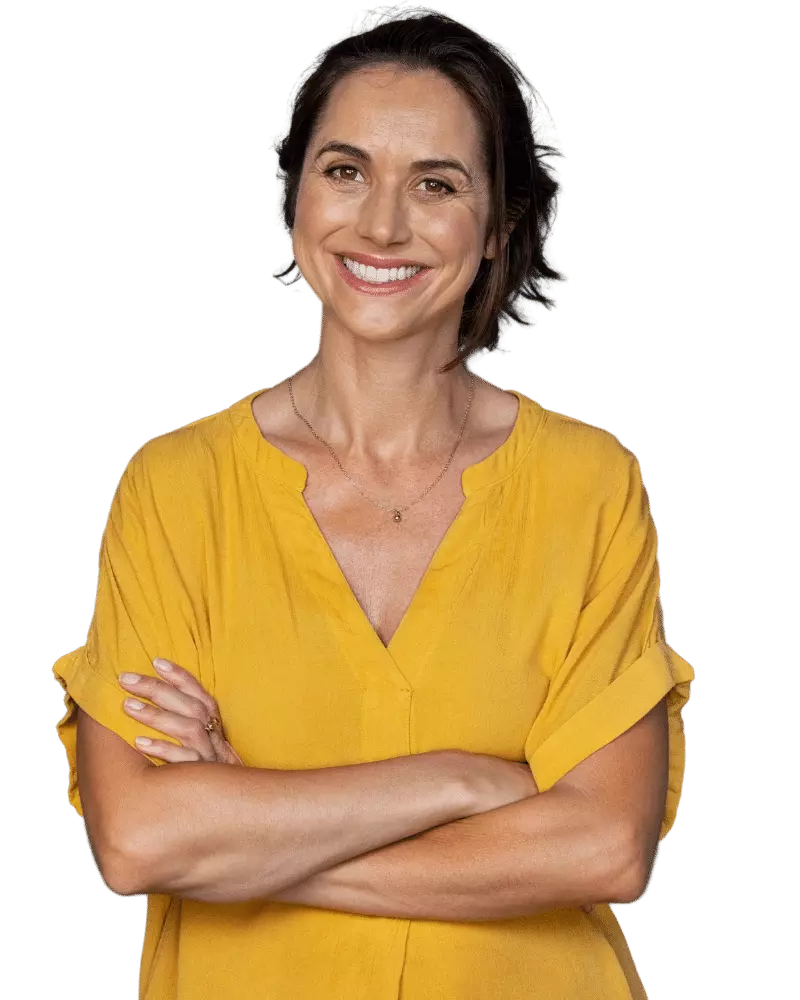 Professional woman with arms crossed smiling at camera